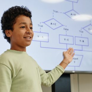 Boy Presenting in Coding Class
