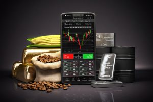Cell phone with commodities. Stock exchange market trading platform on the screen of smartphone .